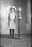 Box 22, Neg. No. 30423: Girl Standing Next to a Vase