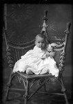 Box 23, Neg. No. 30664: Baby Sitting in a Chair