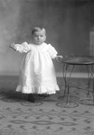 Box 23, Neg. No. 30836: Baby Standing Next to a Table