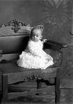 Box 25, Neg. No. 49813: Baby Sitting on a Chair