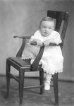 Box 25, Neg. No. 49885R: Baby Sitting on a Chair