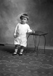 Box 26, Neg. No. 50139: Baby Standing Next to a Table