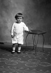 Box 26, Neg. No. 50139x: Baby Standing Next to a Table