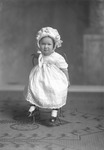 Box 26, Neg. No. 30985B: Baby Wearing a Hat and Dress