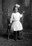 Box 26-2, Neg. No. 34088: Girl Standing in Front of a Chair