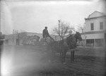 Box 26-3, Neg. No. 35079: Man on a Wagon that is Pulled by Horses