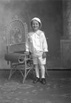 Box 26-3, Neg. No. 38050: Boy Standing Next to a Chair