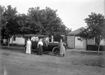 Box 27, Neg. No. 39089: People Standing in Front of an Automobile