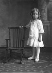 Box 27, Neg. No. 39279AnD39280: Girl Standing Next to a Chair
