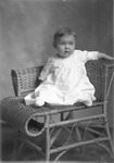 Box 27, Neg. No. 39206: Baby Sitting in a Chair