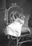 Box 28, Neg. No. 39710: Baby Sitting in a Chair