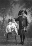 Box 29, Neg. No. 40257: Girl Standing Next to a Baby