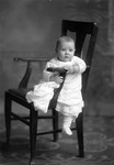 Box 30, Neg. No. 40000: Baby Sitting in a Chair
