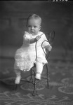 Box 30, Neg. No. 40066: Baby Sitting Backwards on a Chair
