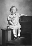 Box 30, Neg. No. 40922: Girl Sitting on the Arm of a Chair