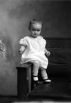 Box 30, Neg. No. 40928: Baby Sitting on the Arm of a Chair