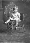 Box 32, Neg. No. 49103: Girl Sitting in a Chair
