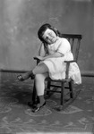 Box 32, Neg. No. 49322: Girl Sitting on a Rocking Chair