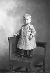Box 32, Neg. No. 49354: Child Standing on a Chair