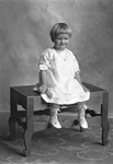 Box 32, Neg. No. 50993: Girl Sitting on a Bench