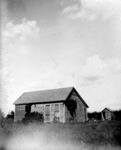 Box 32-2, Neg. No. 1628: House and Outhouse