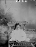 Box 32-2, Neg. No. 2231 / 2392: Baby Sitting in a Chair