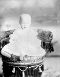 Box 32-2, Neg. No. 1357: Baby Sitting on a Chair