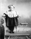 Box 33, Neg. No. 1868: Girl Standing on a Chair