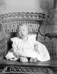 Box 33, Neg. No. 4970B: Baby Sitting in a Chair