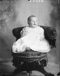 Box 33, Neg. No. 4980B: Baby Sitting in a Chair