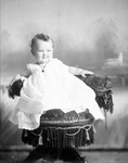 Box 33, Neg. No. 4662A: Baby Sitting in a Chair
