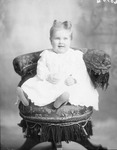 Box 34, Neg. No. 6070B: Baby Sitting in a Chair