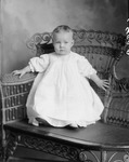 Box 34, Neg. No. 8899A: Baby Sitting in a Chair