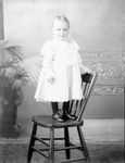 Box 34, Neg. No. 25M: Baby Standing on a Chair