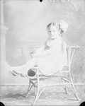 Box 34, Neg. No. 38030: Girl Sitting on a Chair