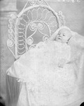Box 35, Neg. No. 38068: Baby Lying on a Chair