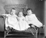 Box 35, Neg. No. 35010: Three Babies on a Chair