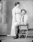 Box 36, Neg. No. 39301: Man Sitting and Woman Standing