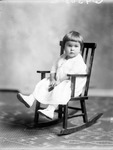 Box 36, Neg. No. 39305: Girl Sitting in a Rocking Chair