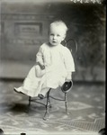 Box 37, Neg. No. 39255: Baby Sitting on a Chair