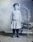 Box 37, Neg. No. 39377: Girl Standing Next to a Chair