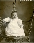 Box 37, Neg. No. 39423: Baby Sitting in a Chair