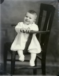 Box 38, Neg. No. 57635C: Baby Sitting in a Chair
