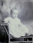 Box 38, Neg. No. 39766: Baby Sitting in a Chair
