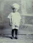 Box 38, Neg. No. 39829: Boy Standing in a Chef's Hat