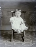 Box 39, Neg. No. 39940: Baby Sitting in a Chair