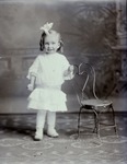 Box 39, Neg. No. 39941: Girl Standing Next to a Chair