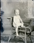 Box 39, Neg. No. 39997: Baby Sitting on a Chair