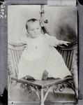 Box 39, Neg. No. 37066: Photograph of Baby Sitting on a Chair