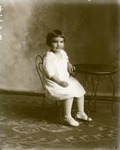 Box 39, Neg. No. 49956: Girl Sitting on a Chair
